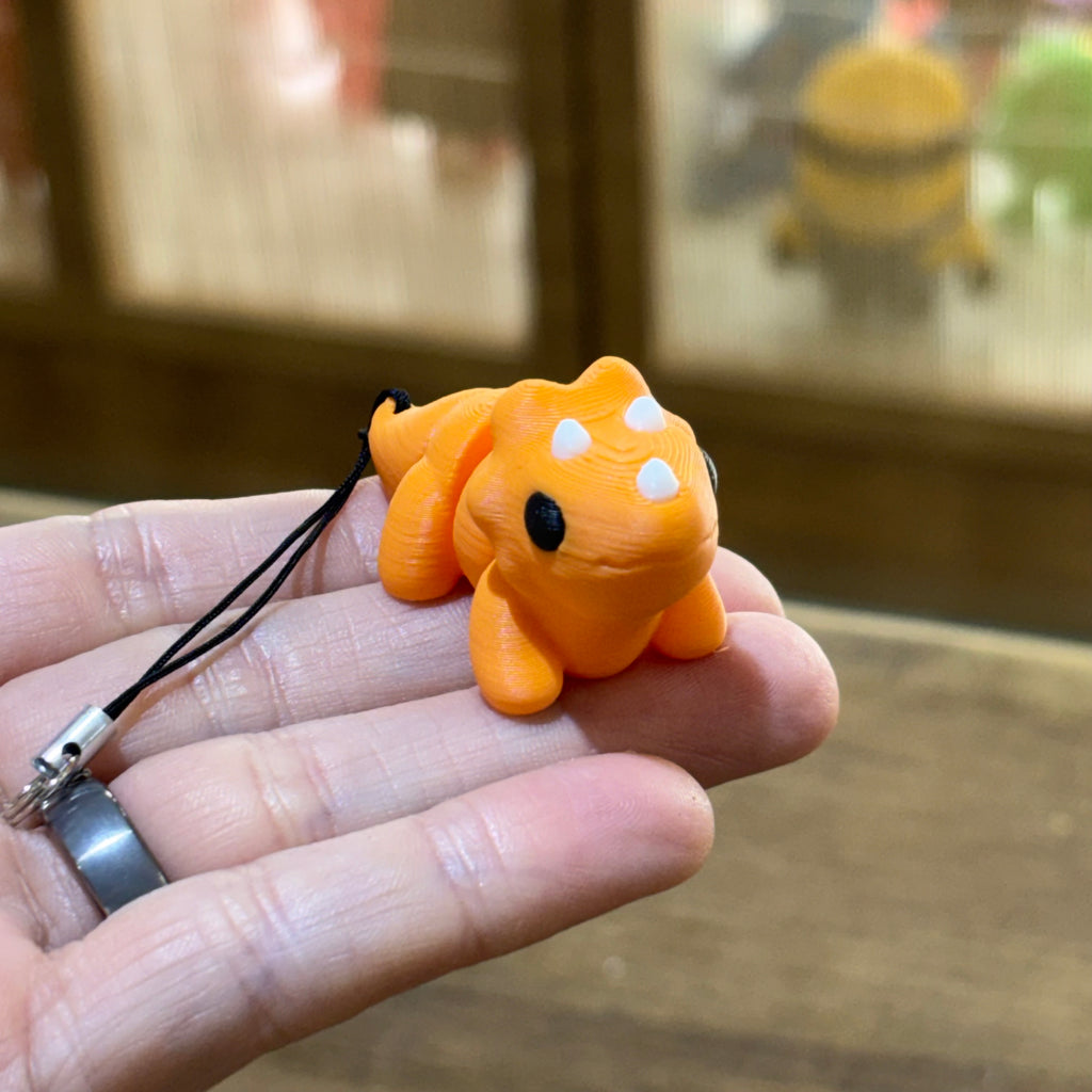 LLAVERO MINI TRICERATOPS FLEXI NARANJA