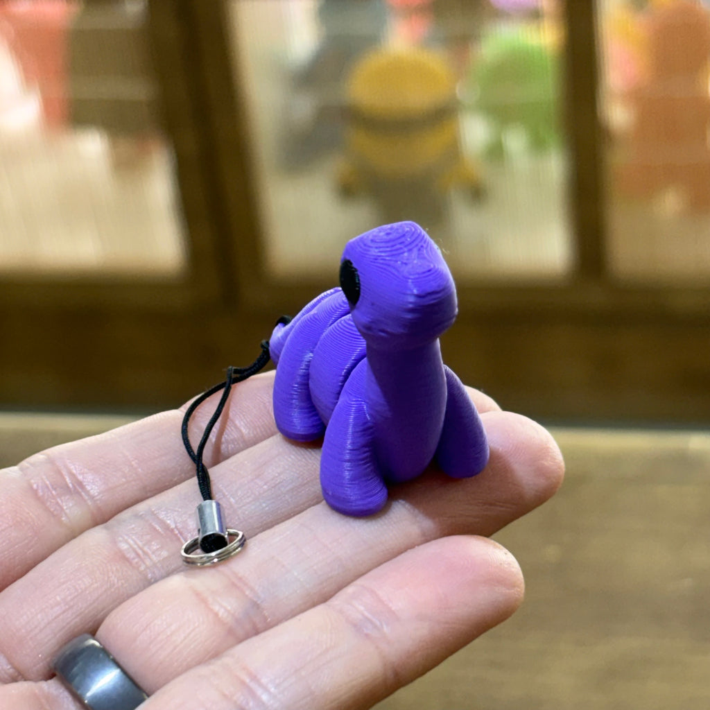 LLAVERO MINI BRONTOSAURUS FLEXI LILA