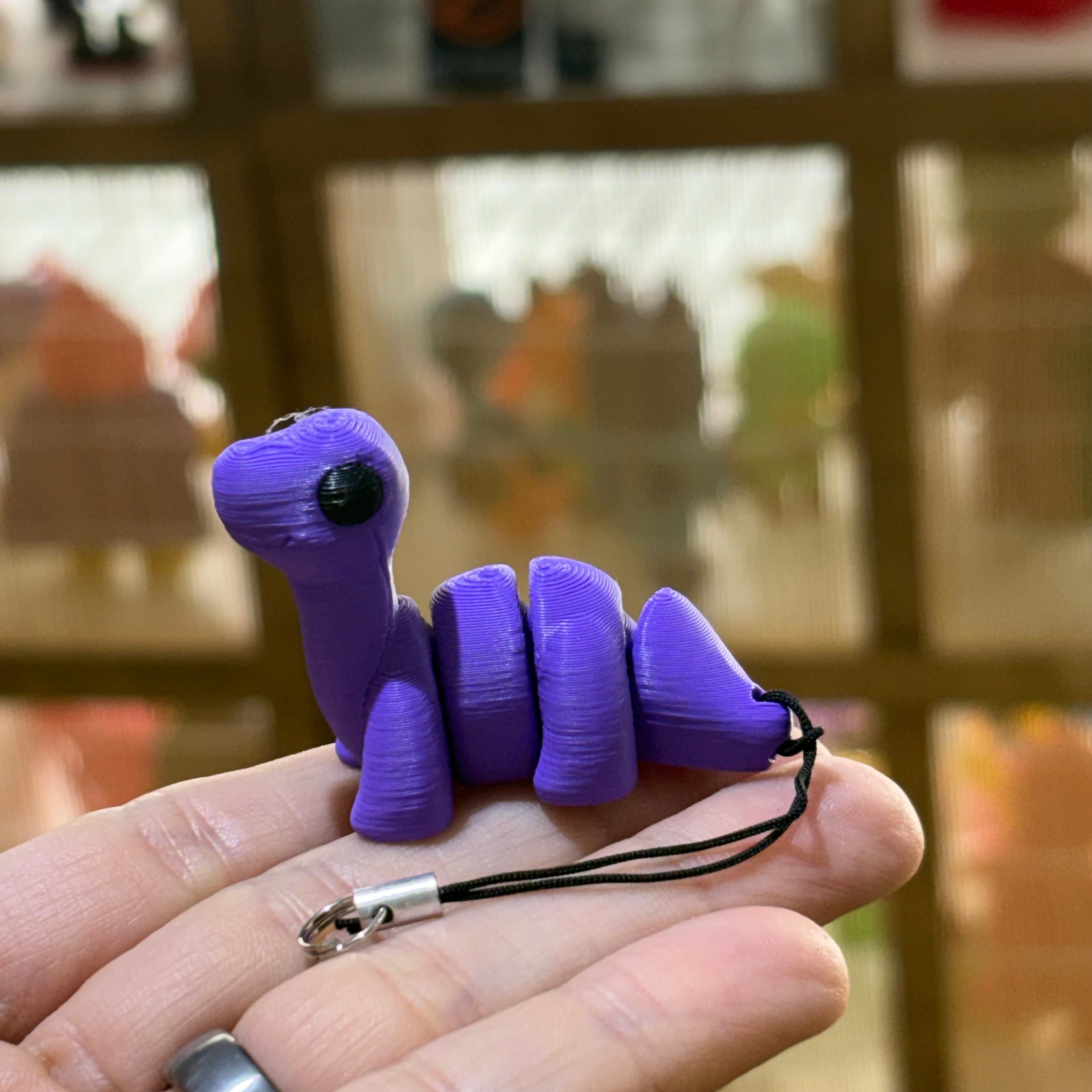 LLAVERO MINI BRONTOSAURUS FLEXI LILA