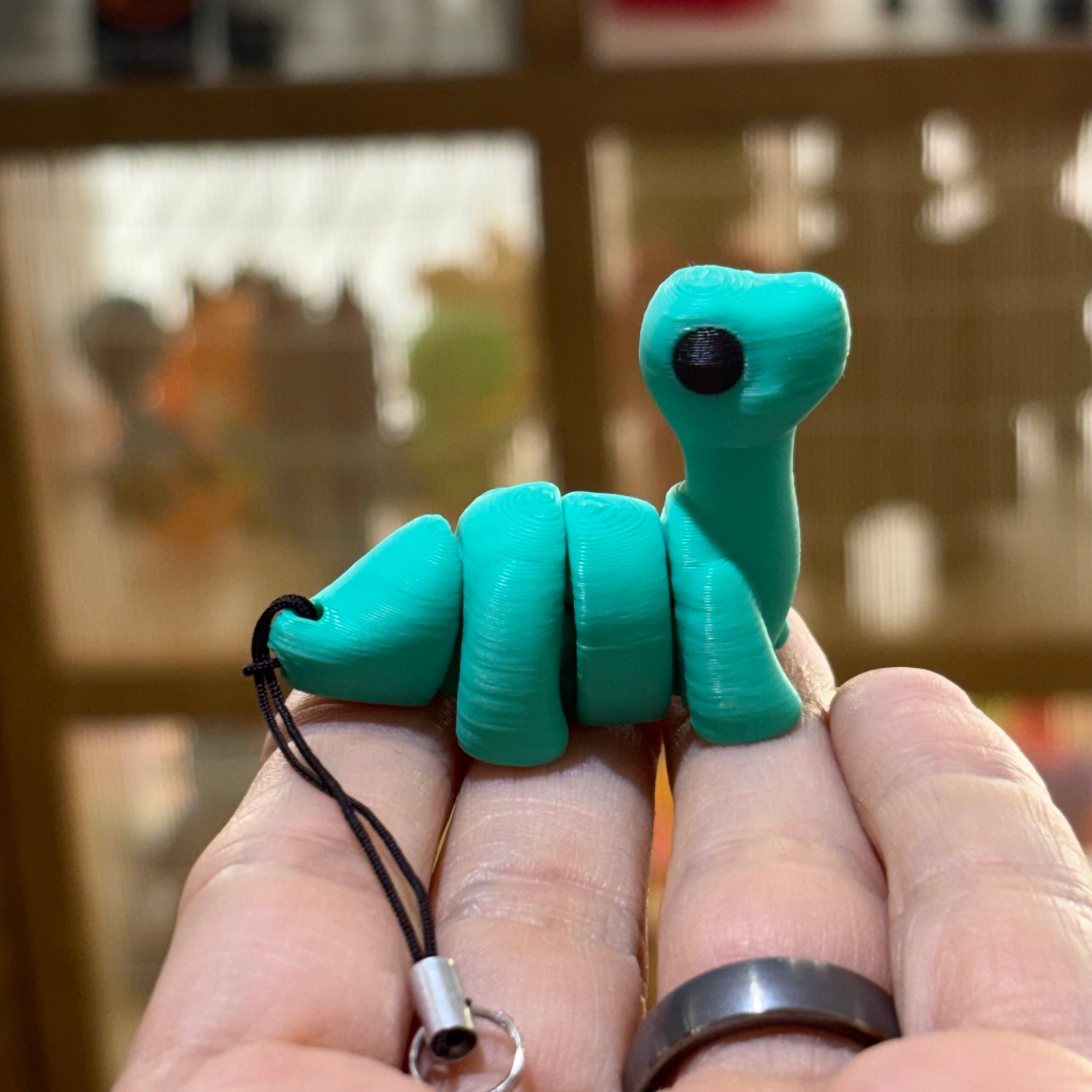 LLAVERO MINI BRONTOSAURUS FLEXI TURQUESA