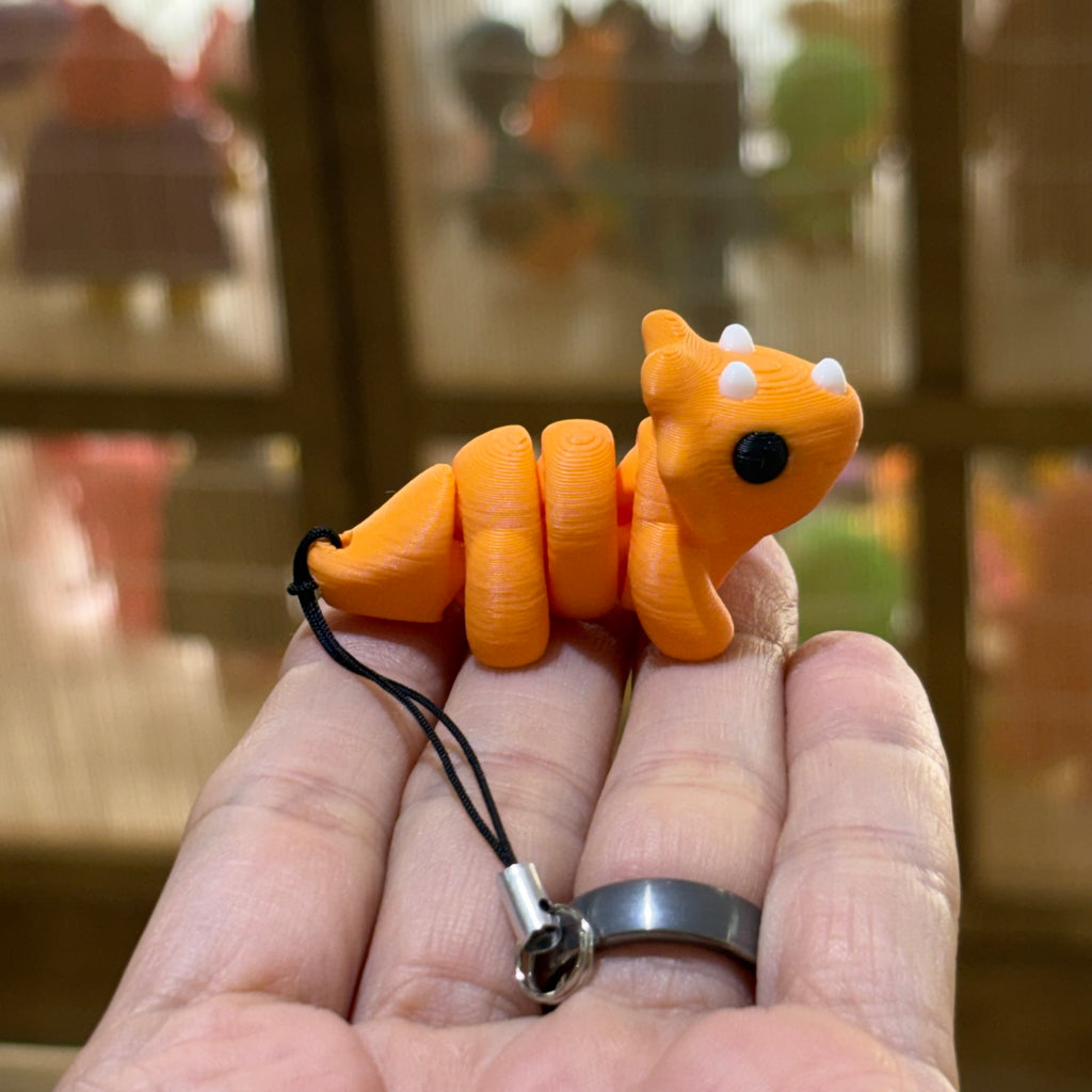 LLAVERO MINI TRICERATOPS FLEXI NARANJA