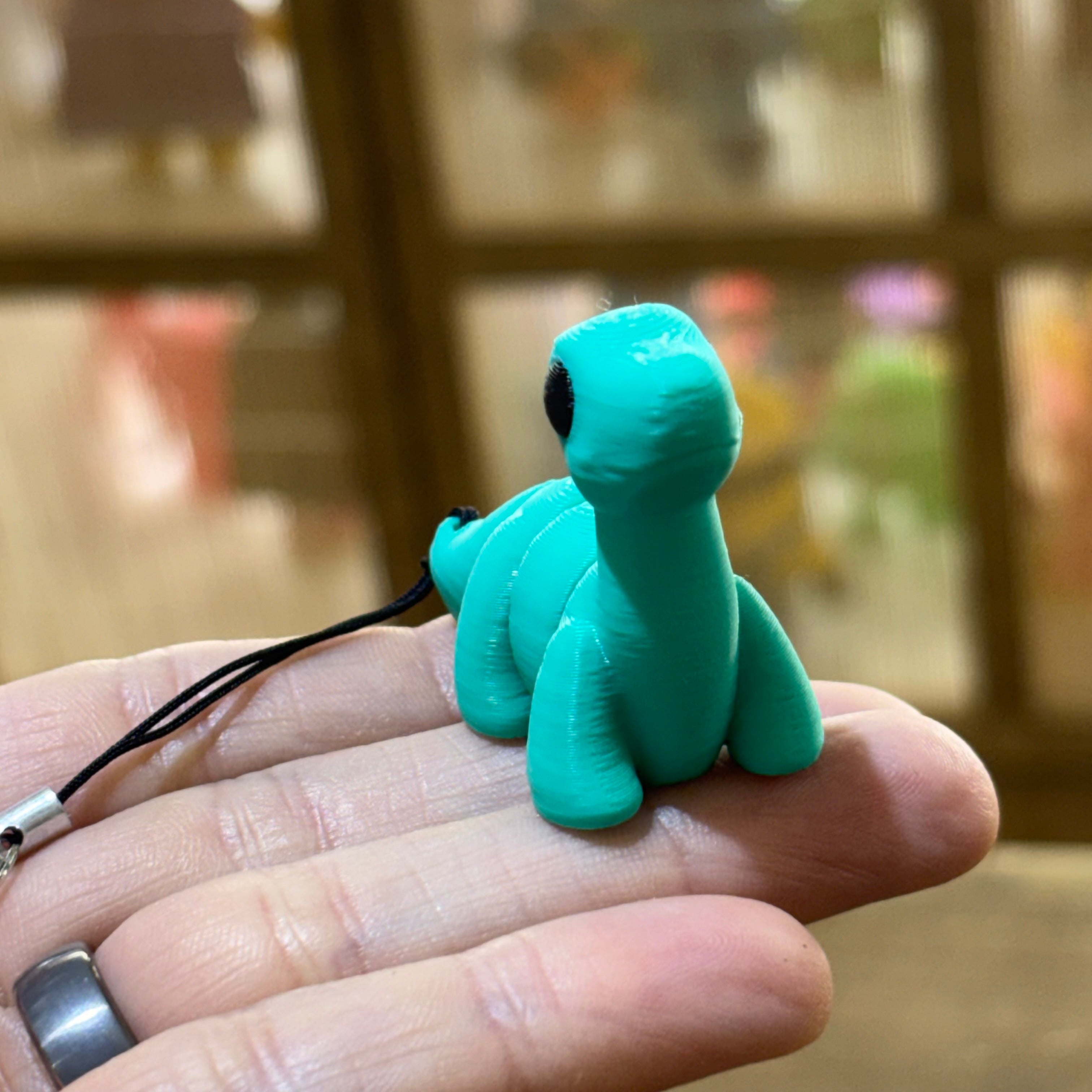 LLAVERO MINI BRONTOSAURUS FLEXI TURQUESA